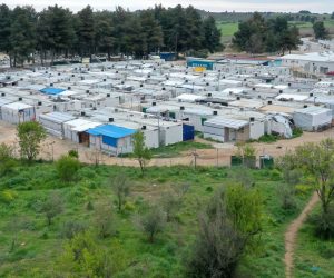 epa08340581 A photograph taken with a drone shows the refugee camp of Ritsona, north of Athens, Greece, 03 April 2020. Deputy Minister for Civil Protection and Crisis Management Nikos Hardalias confirmed on 03 April 2020 that the Ritsona refugee and asylum-seekers facility has been placed on lockdown for the next 14 days as of Thursday morning, after 23 residents so far tested positive for the novel coronavirus.At Ritsona camp lives 2.800 people.  EPA/ANDREAS TSAKNARIDIS