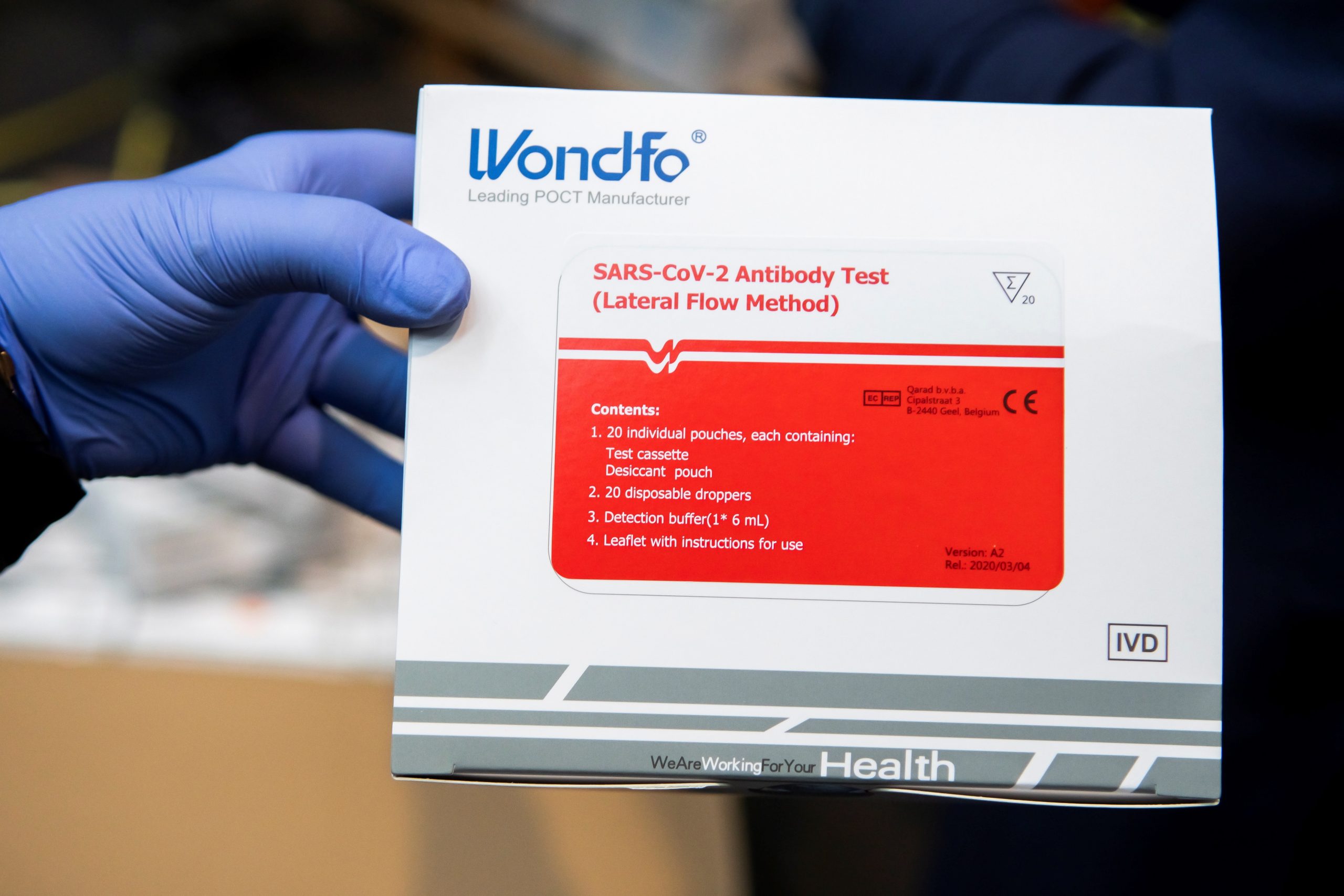 epa08345308 A health worker shows one of the boxes containing 20 coronavirus fast tests in Seville, Spain, 06 April 2020. A total of 130,000 tests arrived to Andalusia, southern Spain, to be distributed amongst hospitals in the region. Spain faces the 23rd consecutive day of mandatory home confinement in a bid to slow down the spread of the pandemic COVID-19 disease caused by the SARS-CoV-2 coronavirus.  EPA/Raul Caro