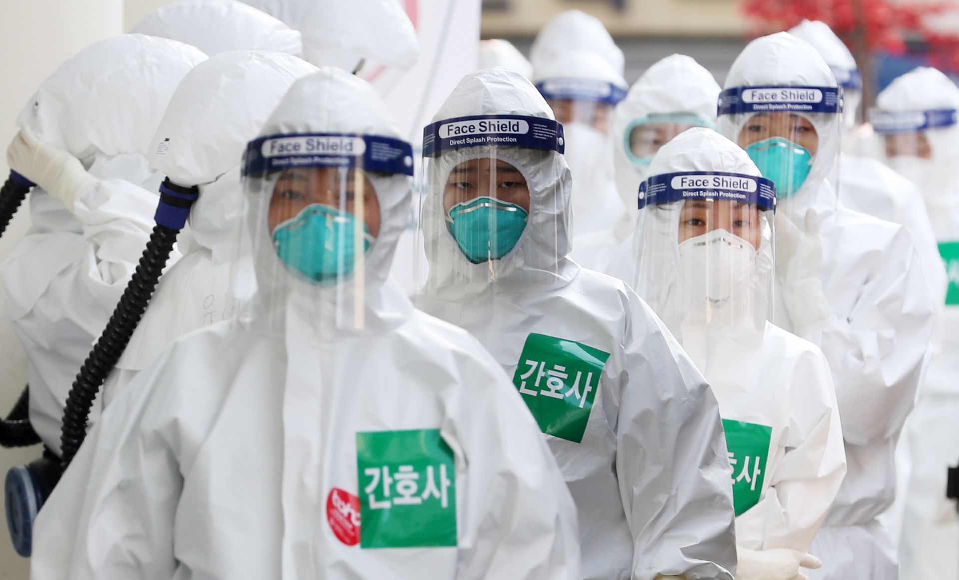 epa08347531 Nurses in full protective suits line up to enter the treatment ward for novel coronavirus patients at the Dongsan Hospital in Daegu, some 300 kilometers southeast of Seoul, South Korea, 07 April 2020.  EPA/YONHAP SOUTH KOREA OUT