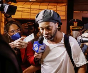 epaselect epa08349593 Brazilian former soccer player Ronaldinho Gaucho arrives at the Hotel Palmaroga in Asuncion, Paraguay, 07 April 2020. Ronaldinho and his brother entered the hotel to serve house arrest after leaving the police headquarters. The brothers remained in police custody for a month after being charged with entering Paraguay with fake passports and were released on a 1.6-million US dollar bail.  EPA/NATHALIA AGUILAR