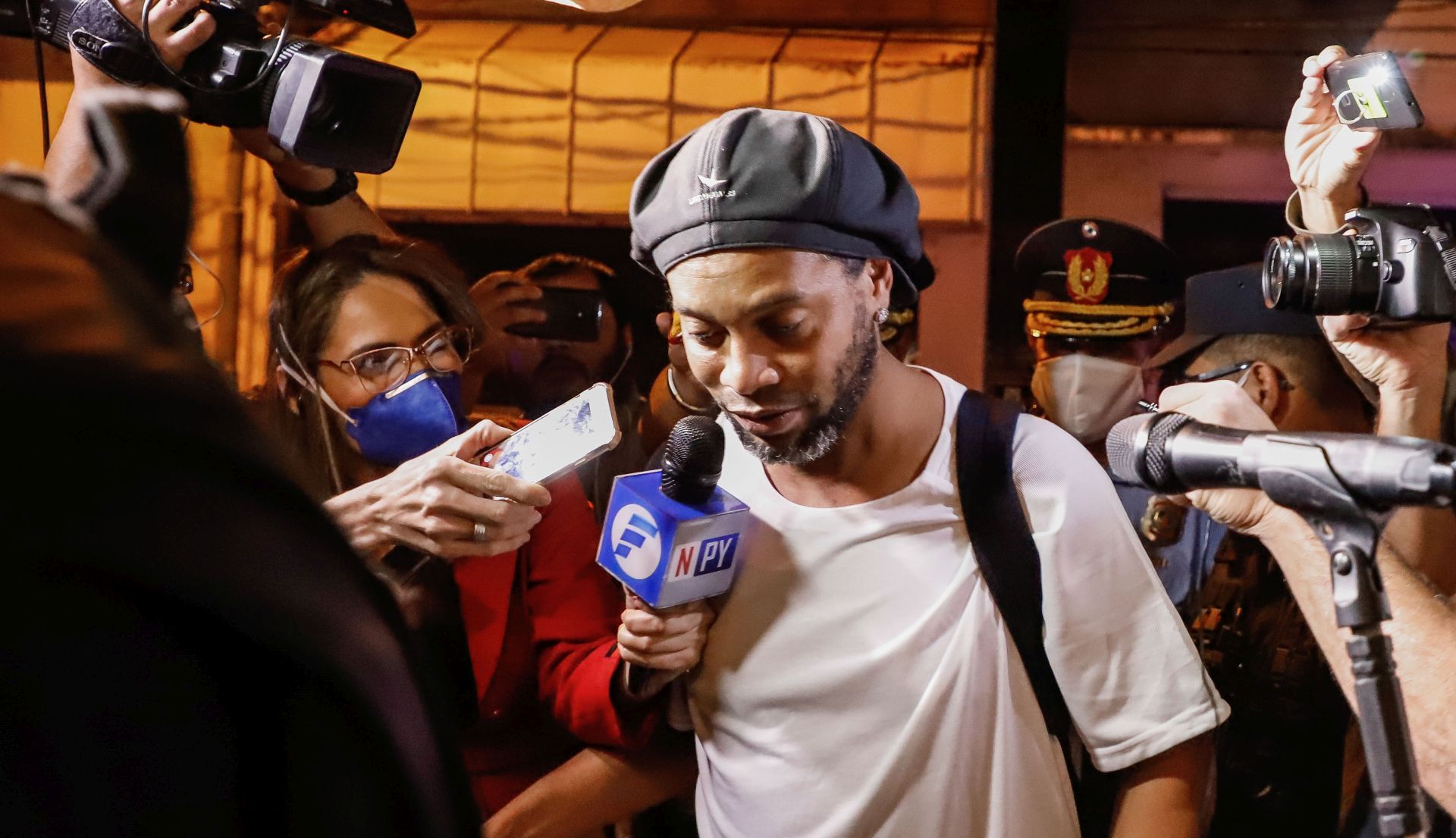 epaselect epa08349593 Brazilian former soccer player Ronaldinho Gaucho arrives at the Hotel Palmaroga in Asuncion, Paraguay, 07 April 2020. Ronaldinho and his brother entered the hotel to serve house arrest after leaving the police headquarters. The brothers remained in police custody for a month after being charged with entering Paraguay with fake passports and were released on a 1.6-million US dollar bail.  EPA/NATHALIA AGUILAR