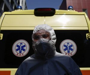 epa08361526 National Emergency Center worker Elias Nikas wears protective gear while poseing for a photograph after transporting a patient with a COVID-19, at a hospital in Athens, Greece, 11 April 2020 (issued 14 April 2020). 'The coronavirus pandemic is subsiding, but the war is not won yet,' Prime Minister Kyriakos Mitsotakis said in a televised message on the evening of 13 April, thanking the Greek people for their trust and discipline and calling on them to continue to respect restrictive measures.  EPA/YANNIS KOLESIDIS