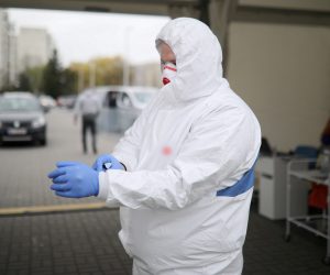 epa08363510 A Polish medical staff works at a drive-thru COVID-19 testing lab in Warsaw, Poland, 15 April 2020. Countries around the world are taking increased measures to stem the widespread of the SARS-CoV-2 coronavirus which causes the COVID-19 disease.  EPA/LESZEK SZYMANSKI POLAND OUT
