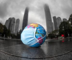 epa08376968 A model of the globe with a face mask left on the ground by the children who were playing with it in Guangzhou, Guangdong province, China, 22 April 2020. World Earth Day is marked in many countries annually on 22 April to raise awareness of environmental protection.  EPA/ALEX PLAVEVSKI