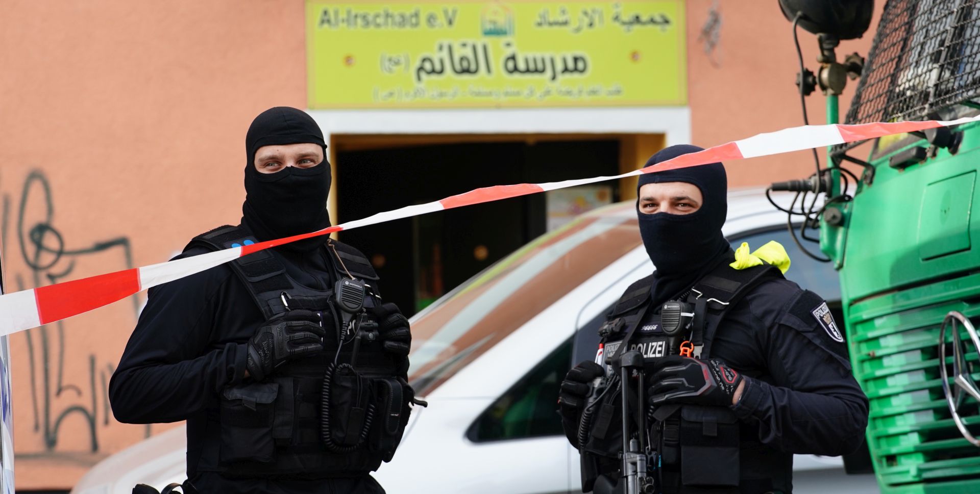 epa08392686 Armed police officers stand guard in front of the Al-Irschad association in Berlin, Germany, 30 April 2020. The German Minister of Interior, Construction and Homeland announced on the day that it has banned Iran-backed Hezbollah activity on German soil and designated it a terrorist organization. Police conducted early morning raids on mosque associations in several federal states, media reported.  EPA/CLEMENS BILAN