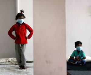 Lockdown to slow the spread of the coronavirus disease (COVID-19), in New Delhi Children of migrant workers wear protective masks inside a sports complex turned into a shelter, during a 21-day nationwide lockdown to slow the spread of the coronavirus disease (COVID-19), in New Delhi, India, April 4, 2020. REUTERS/Adnan Abidi ADNAN ABIDI