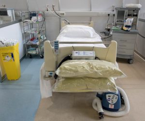 FILE PHOTO: Britain builds NHS Nightingale Hospital for coronavirus patients in London FILE PHOTO: A hospital bed and respirator at ExCel London, seen inside during its conversion into the temporary NHS Nightingale Hospital, comprising of two wards, each of 2,000 people, to help tackle the coronavirus outbreak, in Newham, London, Britain March 30, 2020. To match Special Report HEALTH-CORONAVIRUS/BRITAIN-PATH   Stefan Rousseau/Pool via REUTERS/File Photo POOL New