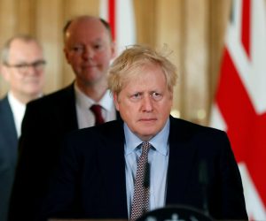 FILE PHOTO: Britain's Prime Minister Boris Johnson attends a news conference on the novel coronavirus, in London FILE PHOTO: Britain's Prime Minister Boris Johnson, Chris Whitty, Chief Medical Officer for England and Chief Scientific Adviser to the Government, Sir Patrick Vallance, arrive for a news conference on the novel coronavirus, in London, Britain March 3, 2020.   To match Special Report HEALTH-CORONAVIRUS/BRITAIN-PATH  Frank Augstein/Pool via REUTERS/File Photo POOL New