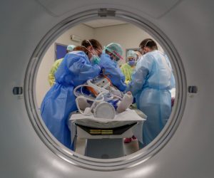 epa08392182 A COVID-19 patient is cared for by the nursing staff in order to perform a lung scan at the Etterbeek-Ixelles site of the Iris Sud Hospitals in Brussels, Belgium, 29 April 2020. Countries worldwide increased their measures to prevent the widespread of the SARS-CoV-2 coronavirus which causes the COVID-19 disease while crucial businesses like grocery stores, pharmacies, public transportation and health services are still open.  EPA/STEPHANIE LECOCQ