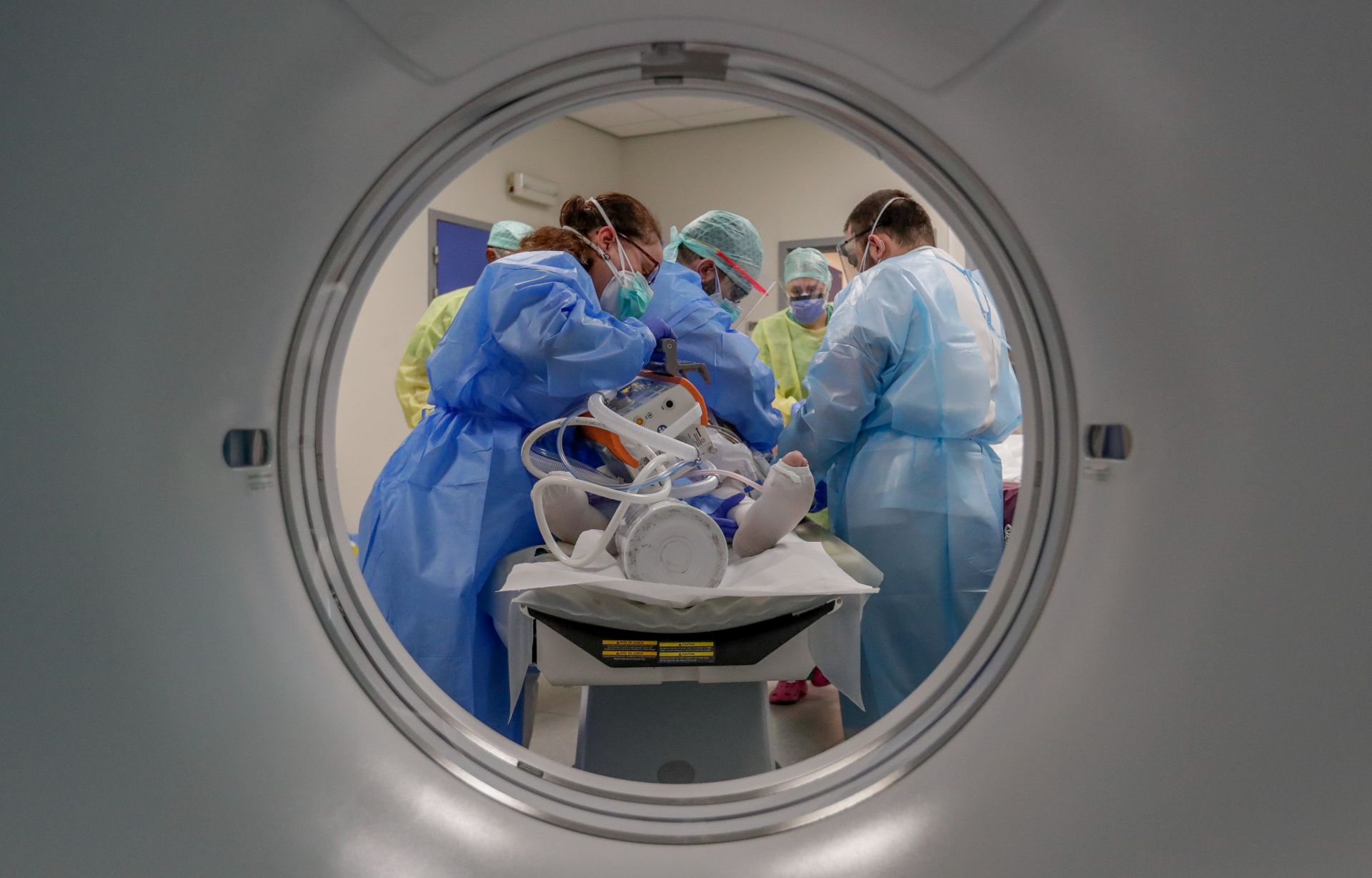 epa08392182 A COVID-19 patient is cared for by the nursing staff in order to perform a lung scan at the Etterbeek-Ixelles site of the Iris Sud Hospitals in Brussels, Belgium, 29 April 2020. Countries worldwide increased their measures to prevent the widespread of the SARS-CoV-2 coronavirus which causes the COVID-19 disease while crucial businesses like grocery stores, pharmacies, public transportation and health services are still open.  EPA/STEPHANIE LECOCQ