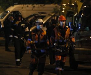 epa08412324 Fireworker pass by ambulances near a  hospital where a fire erupted in northern Moscow, Russia, 09 May 2020. According to media reports, one person was killed in a fire at the hospital where patients with coronovirus disease CODID-19 are being treated.  EPA/SERGEI ILNITSKY