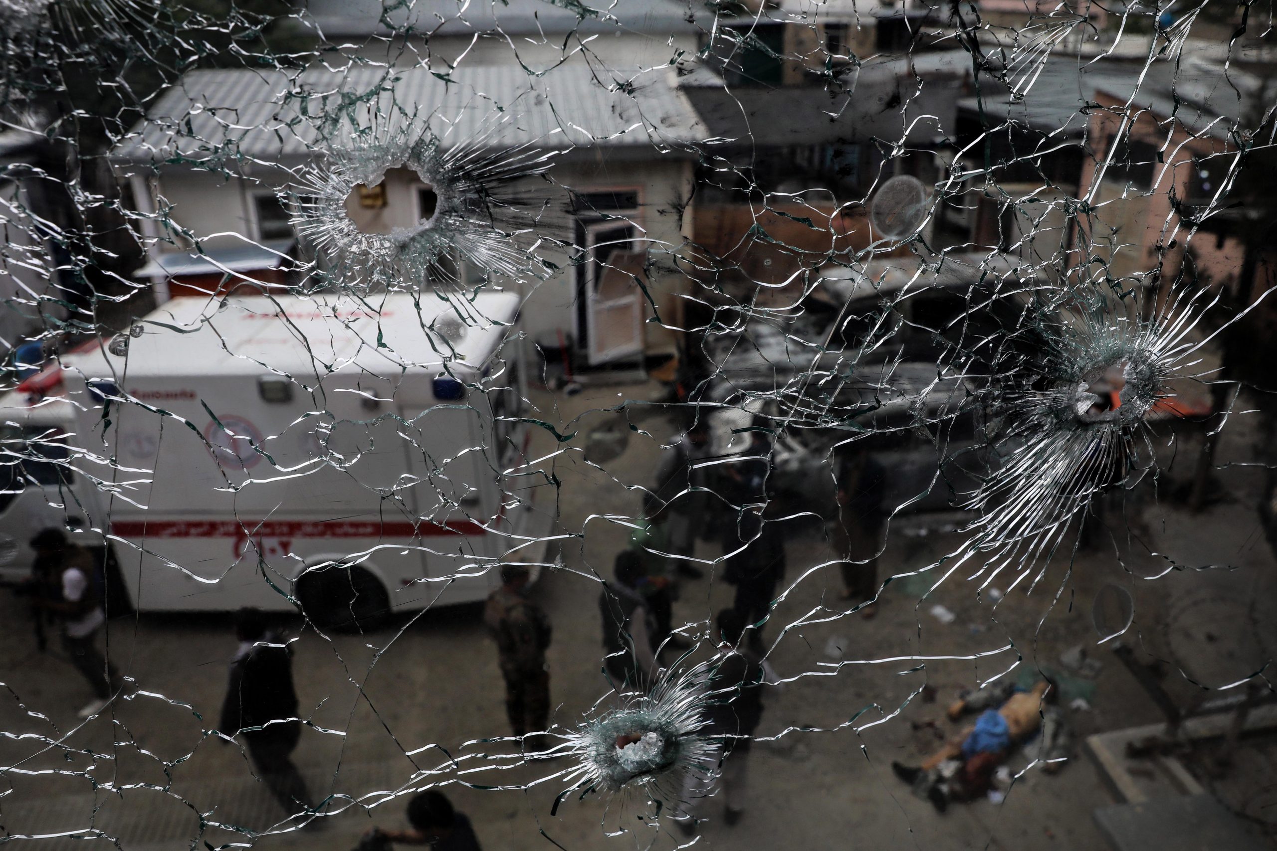 epa08416928 A bullet ridden window at the scene of an attack at MSF (Doctors without Borders) hospital, in Kabul, Afghanistan, 12 May 2020. According to reports, at least 12 people were killed and 16 others injured including women and children when the Gunmen entered the MSF clinic in Kabul.  EPA/HEDAYATULLAH AMID ATTENTION EDITORS GRAPHIC CONTENT