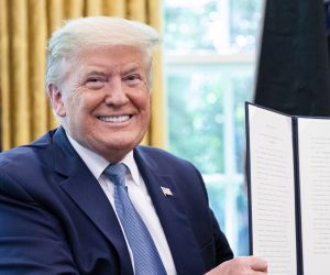 epa08424721 US President Donald J. Trump signs the 2020 Armed Forces Day Proclamation after being presented the official flag of the United States Space Force at the White House in Washington, DC, USA, on 15 May 2020.  EPA/Samuel Corum / POOL