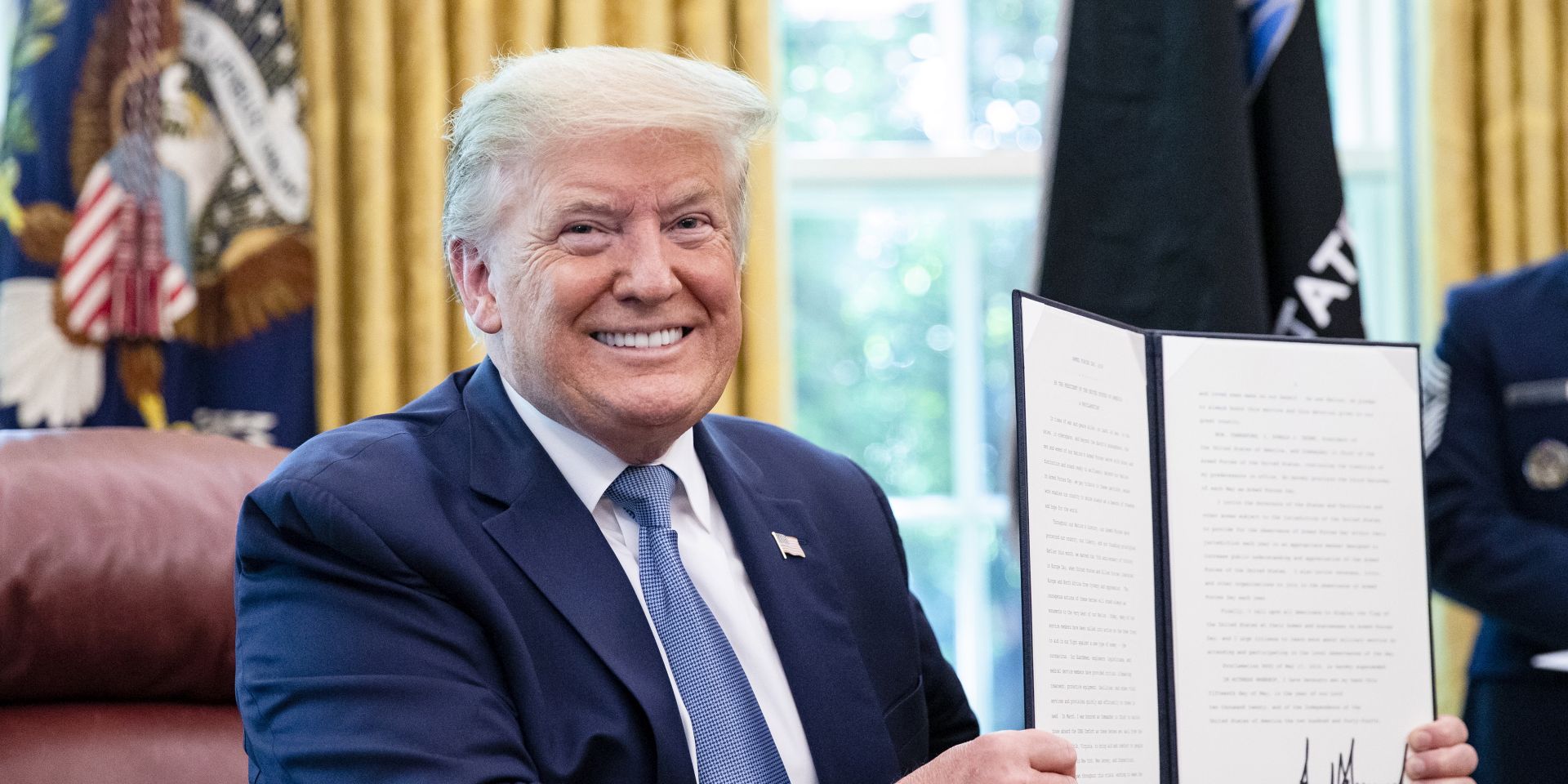 epa08424721 US President Donald J. Trump signs the 2020 Armed Forces Day Proclamation after being presented the official flag of the United States Space Force at the White House in Washington, DC, USA, on 15 May 2020.  EPA/Samuel Corum / POOL