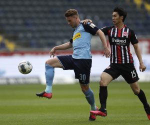 epa08426541 Frankfurt's Daichi Kamada, right, challenges Moenchengladbach's Nico Elvedi, left, during the German Bundesliga soccer match between Eintracht Frankfurt and Borussia Moenchengladbach in Frankfurt, Germany, 16 May 2020. The German Bundesliga becomes the world's first major soccer league to resume after a two-month suspension because of the coronavirus pandemic.  EPA/Michael Probst / POOL DFL regulations prohibit any use of photographs as image sequences and/or quasi-video.
