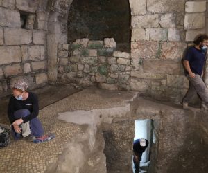 epa08431410 Israeli archaeologists work at an archeological excavation site in the Western Wall Tunnels,  Jerusalem, 19 May 2020. The Israel Antiquities Authority said archaeologists discovered an unique subterranean system hewn in the bedrock from the Second Temple period beneath a1400-year-old public building in the underground excavations under the Western Wall.  EPA/ABIR SULTAN