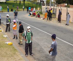 epa08431766 Local residents line up patiently during a food handout by 'Hunger has no religion group' in Carination on day 53 of the national lockdown as a result of Covid-19 Coronavirus, in Johannesburg, South Africa, 19 May 2020. The origination feeds 1,500 people per day for six days a week. Food insecurity is one of the main issues facing the country since the start of lockdown. The country is at level 4 of the national lockdown in its 46 day after it was implemented on 30 April 2020.  EPA/KIM LUDBROOK