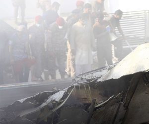 epa08437580 Rescue workers search for the bodies or survivors amid wreckage of the passenger plane of state run Pakistan International Airlines, after it crashed on a residential colony, in Karachi, Pakistan, 22 May 2020. A Pakistan International Airlines passenger flight with over 100 people on board crashed on 22 May as it was about to land near a residential area close to the airport in the port city of Karachi, a civil aviation official said.  EPA/SHAHZAIB AKBER
