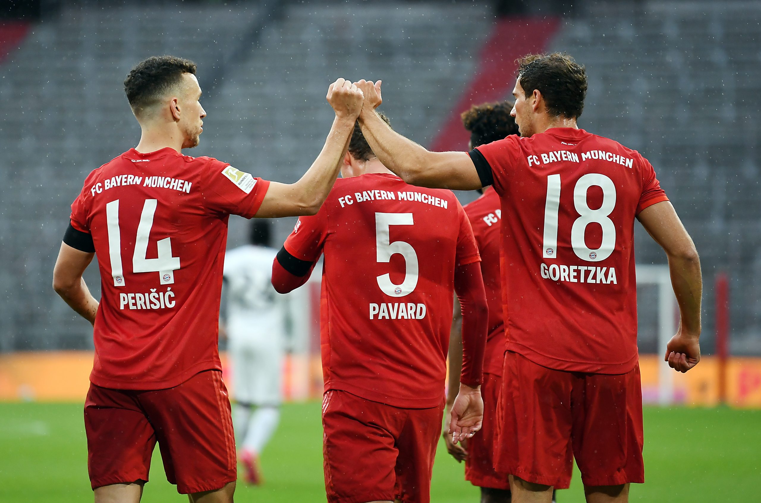 epa08439878 Bayern Munich's Leon Goretzka (R) celebrates with teammate Ivan Perisic (L) after scoring during the German Bundesliga soccer match Bayern Munich vs Eintracht Frankfurt in Munich, Germany, 23 May 2020. The German Bundesliga is the world's first major soccer league to resume after a two-month suspension because of the Coronavirus pandemic.  EPA/ANDREAS GEBERT / POOL DFL regulations prohibit any use of photographs as image sequences and/or quasi-video.