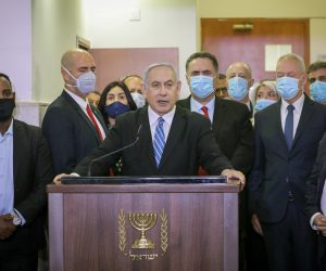epa08441309 Israeli Prime Minister Benjamin Netanyahu delivers a statement  before entering the district court room where he is facing a trial for alleged corruption crimes in Salah El-Din, East Jerusalem, 24 May 2020. Netanyahu has been charged with counts of bribery, fraud and breach of trust, becoming the first Israeli leader to be tried for alleged corruption while still in office. The trial comes only a week after Netanyahu was sworn into office for another term following a rare power-sharing deal with his adversary, who is set to take over as prime minister in 18 months as he switches roles with Netanyahu, who would then become Gantz's deputy.  EPA/YONATAN SINDEL / POOL