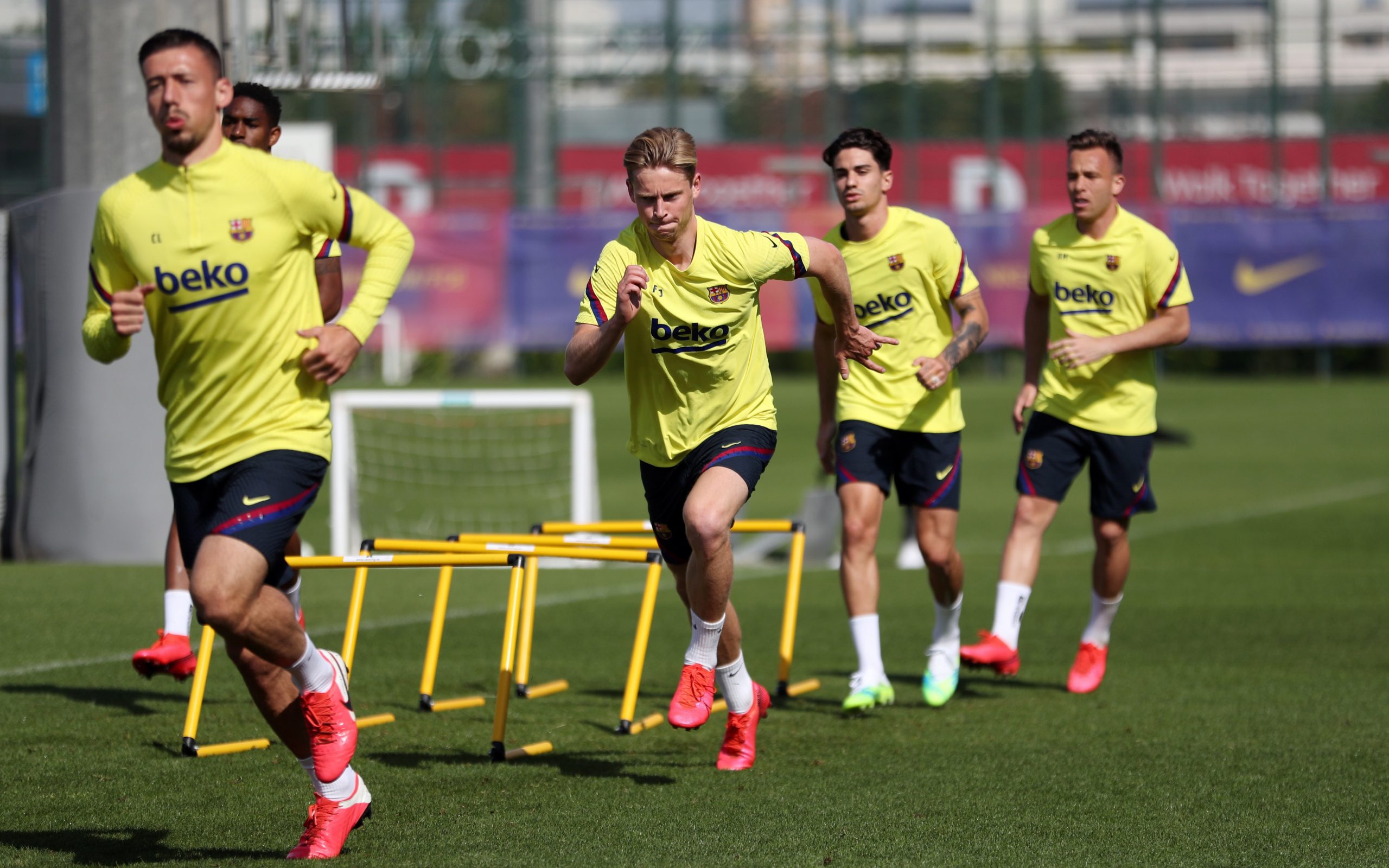 epa08443468 A handout picture provided by FC Barcelona shows FC Barcelona's midfielders Frankie de Jong (C) and Arthur Melo (R) and defender Clement Lenglet (L) during a training session at Joan Gamper Sports City in Barcelona, Catalonia, Spain, 25 May 2020. FC Barcelona began the training sessions on groups of 14 players due to coronavirus health protocol.  EPA/Miguel Ruiz / HANDOUT  HANDOUT EDITORIAL USE ONLY/NO SALES