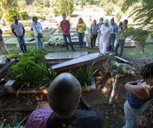 epa08445146 A small number of people accompany the burial of a COVID-19 victim at the Campo de Esperanza cemetery, in Brasilia, Brazil, 26 May 2020.  EPA/Joedson Alves