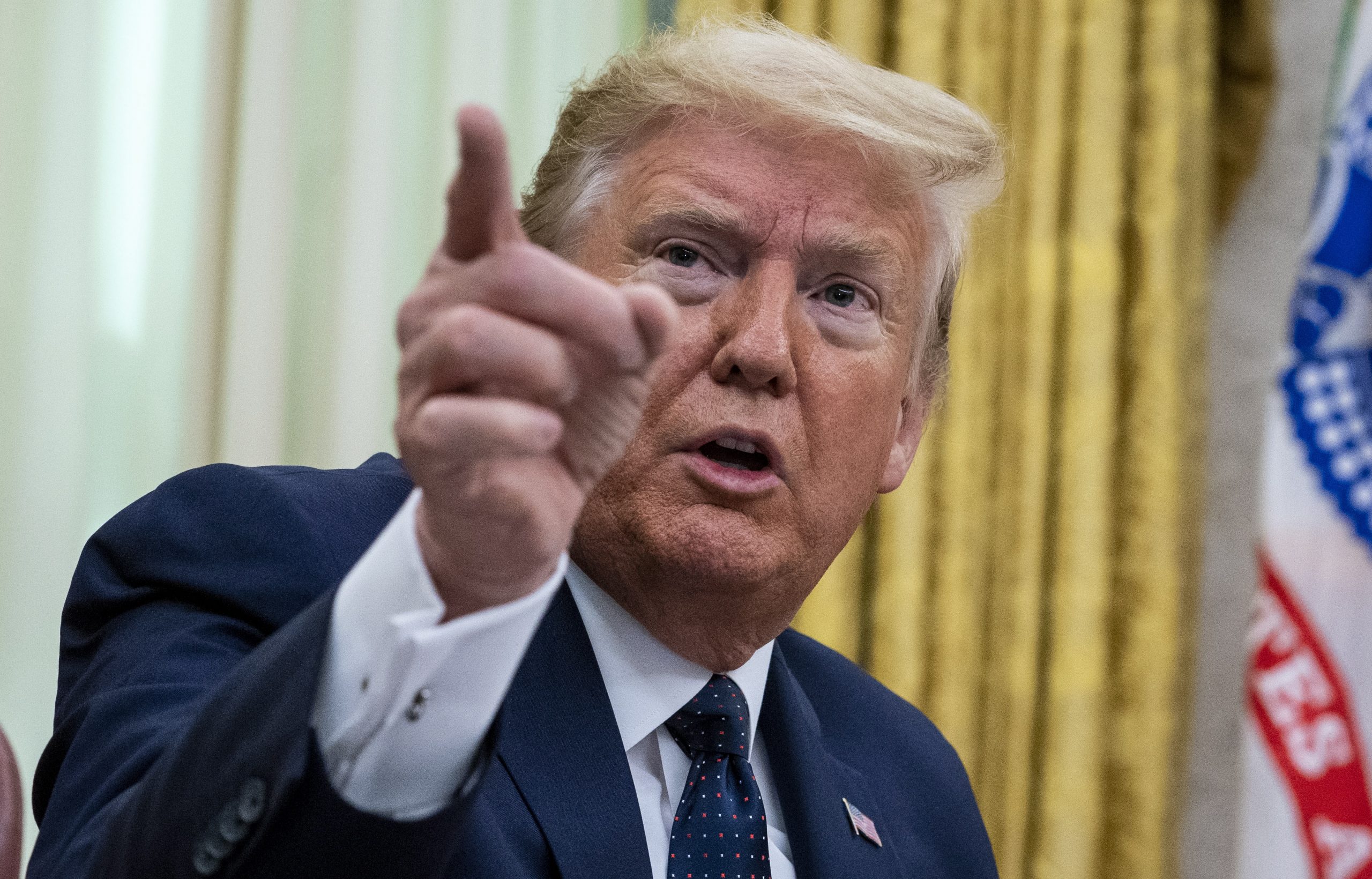 epa08450844 US President Donald J. Trump makes remarks before signing an executive order on social media that will punish Facebook, Google and Twitter for the way they police content online,  in the Oval Office, White House, Washington, DC, USA, 28 May 2020.  EPA/DOUG MILLS/ POOL