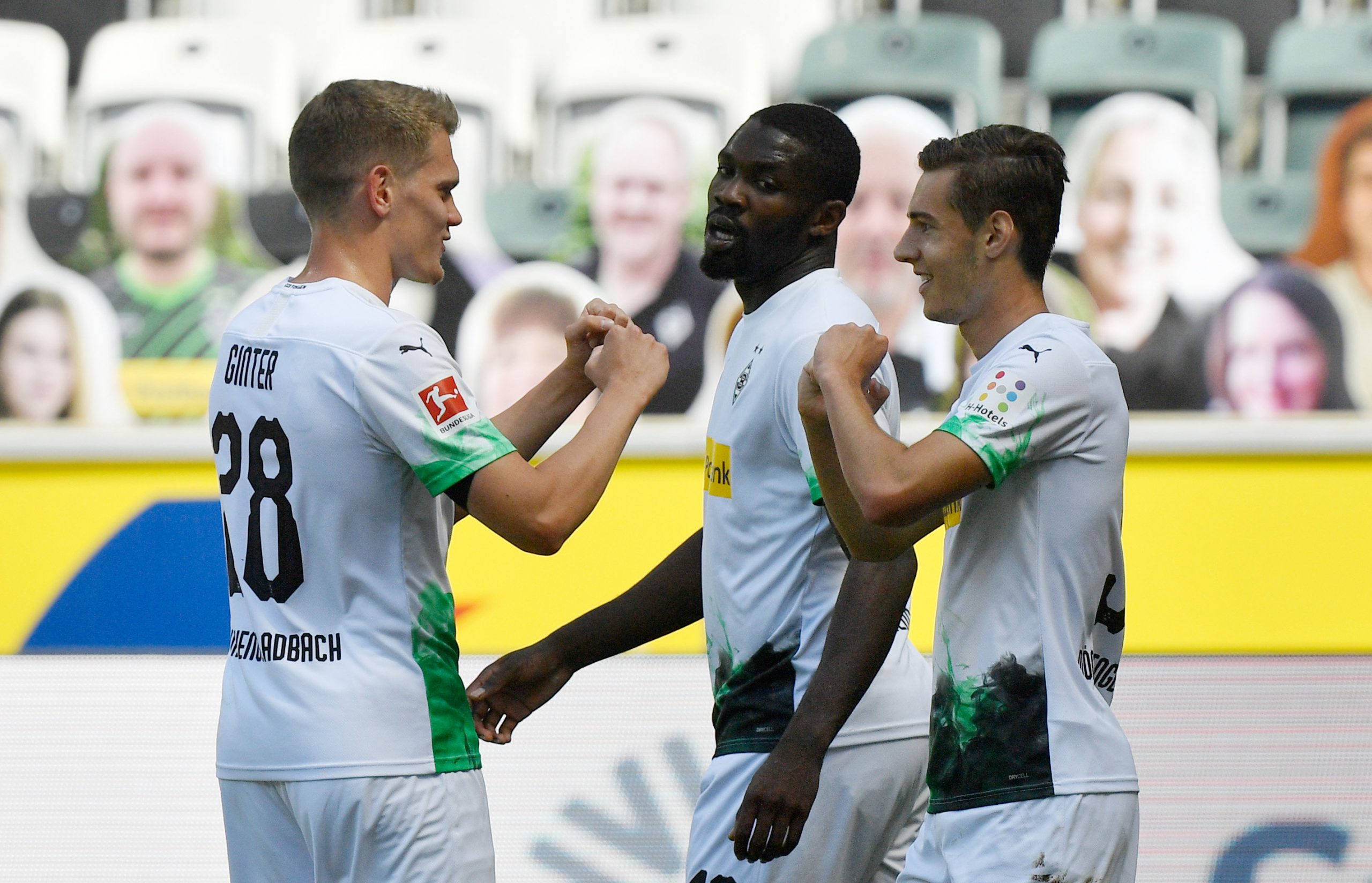 31 May 2020, North Rhine-Westphalia, Moenchengladbach: Borussia Moenchengladbach's Florian Neuhaus (R) celebrates scoring his side's first goal with teammates Matthias Ginter (L) and Marcus Thuram during the German Bundesliga soccer match between Borussia Moenchengladbach and Union Berlin at Borussia-Park. Photo: Martin Meissner/AP Pool/dpa - IMPORTANT NOTICE: DFL and DFB regulations prohibit any use of photographs as image sequences and/or quasi-video.