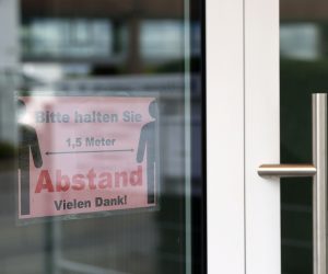 Outbreak of the coronavirus disease (COVID-19) in Frankfurt The sign at the entrance to the prayer room of Evangelical Christian Baptist church reads "Keep 1.5 meter distance", as the spread of the coronavirus disease (COVID-19) continues, in Frankfurt, Germany May 24, 2020. REUTERS/Kai Pfaffenbach KAI PFAFFENBACH