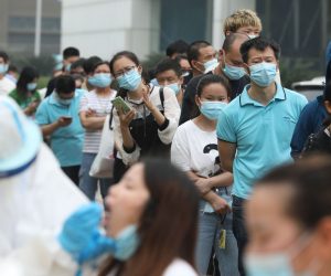 epa08423298 Workers queue for a coronavirus test at a factory in Wuhan, China, 15 May 2020. The city plans to test all its citizens, over 10 million people, within the next 10 days.  EPA/LI KE CHINA OUT