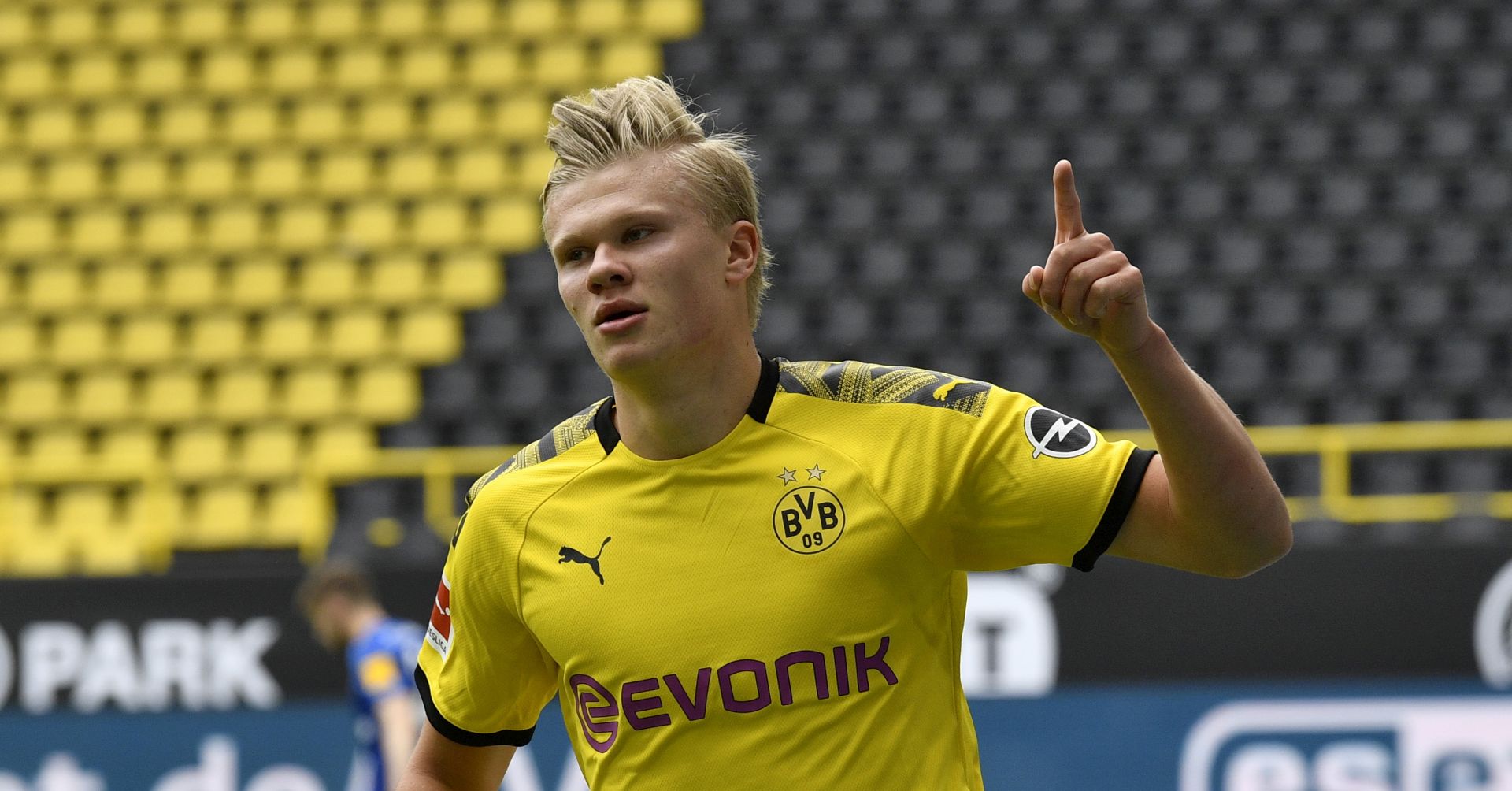 epa08425960 Dortmund's Erling Haaland celebrates after scoring the opening goal during the German Bundesliga soccer match between Borussia Dortmund and Schalke 04 in Dortmund, Germany, 16 May 2020. The German Bundesliga and Second Bundesliga are the first professional leagues to resume the season after the nationwide lockdown due to the ongoing Coronavirus (COVID-19) pandemic. All matches until the end of the season will be played behind closed doors.  EPA/MARTIN MEISSNER / POOL DFL regulations prohibit any use of photographs as image sequences and/or quasi-video.