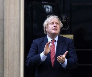 epa08450635 British Prime Minister Boris Johnson takes part during the 'Clap for our Carers' campaign in support of Britain's National Health Service (NHS) in 10 Downing Street, Central London, Britain, 28 May 2020. People all over Britain stepped out of their homes and to the streets to take part in Clap For Our Carers initiative started by Annemarie Plas, and give a round of applause for key workers, particularly NHS staff on the frontline treating patients with coronavirus.  EPA/WILL OLIVER