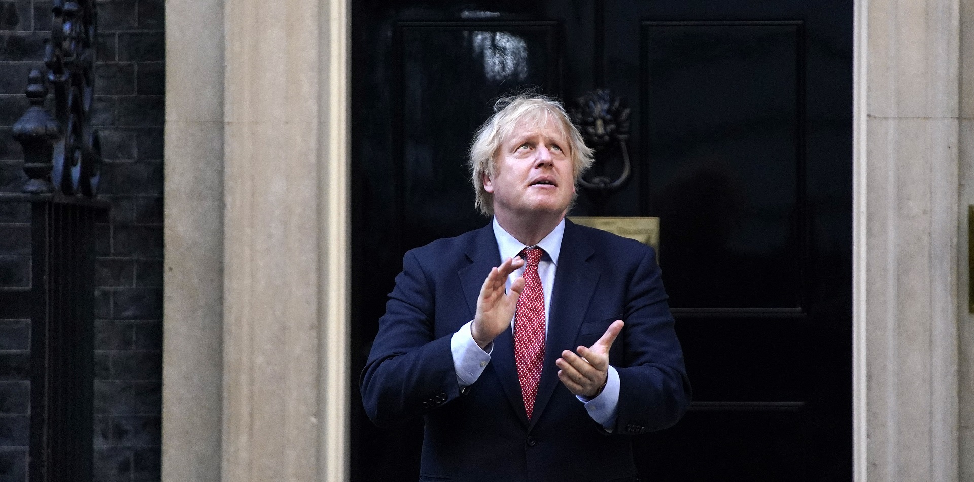 epa08450635 British Prime Minister Boris Johnson takes part during the 'Clap for our Carers' campaign in support of Britain's National Health Service (NHS) in 10 Downing Street, Central London, Britain, 28 May 2020. People all over Britain stepped out of their homes and to the streets to take part in Clap For Our Carers initiative started by Annemarie Plas, and give a round of applause for key workers, particularly NHS staff on the frontline treating patients with coronavirus.  EPA/WILL OLIVER