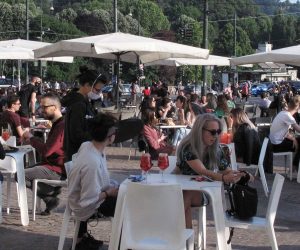 epa08456553 People sit at the tables located outside the bars in the center of Turin, during Phase 2 of the emergency Covid-19, Turin, Italy, 31 May 2020.  EPA/ALESSANDRO DI MARCO