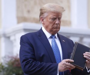 epa08459197 US President Donald J. Trump poses with a bible outside St. John's Episcopal Church after delivering remarks in the Rose Garden at the White House in Washington, DC, USA, 01 June 2020. Trump addressed the nationwide protests following the death of George Floyd in police custody.  EPA/SHAWN THEW