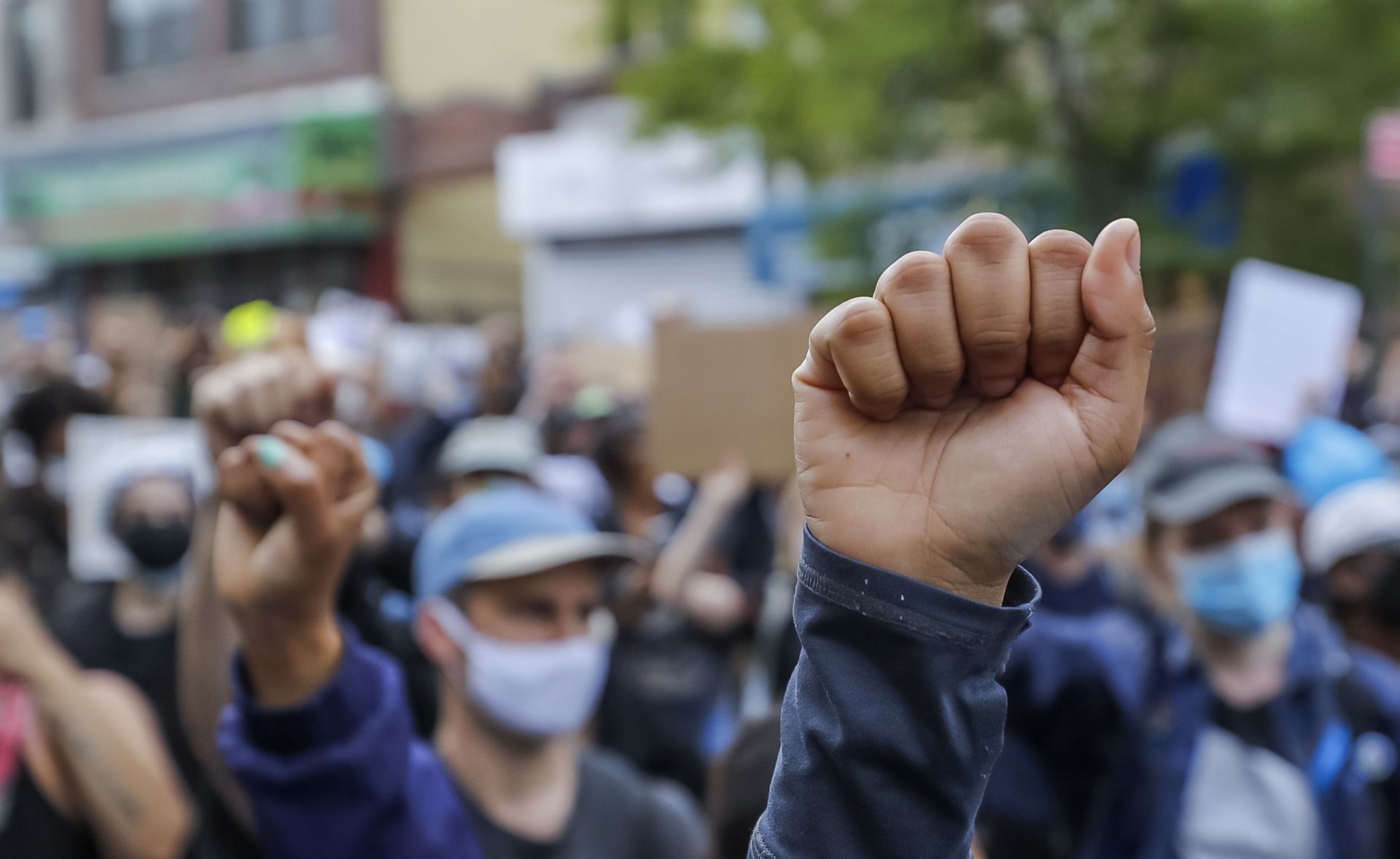 epa08459205 People participate in a protest over the Minneapolis, Minnesota arrest of George Floyd, who later died in police custody, in Brooklyn, New York, USA, 01 June 2020.  A bystander's video posted online on 25 May, appeared to show George Floyd, 46, pleading with arresting officers that he couldn't breathe as an officer knelt on his neck. The unarmed Black man later died in police custody. According to news reports on 29 May, Derek Chauvin, the police officer in the center of the incident has been taken into costody and charged with murder in the George Floyd killing.  EPA/JUSTIN LANE