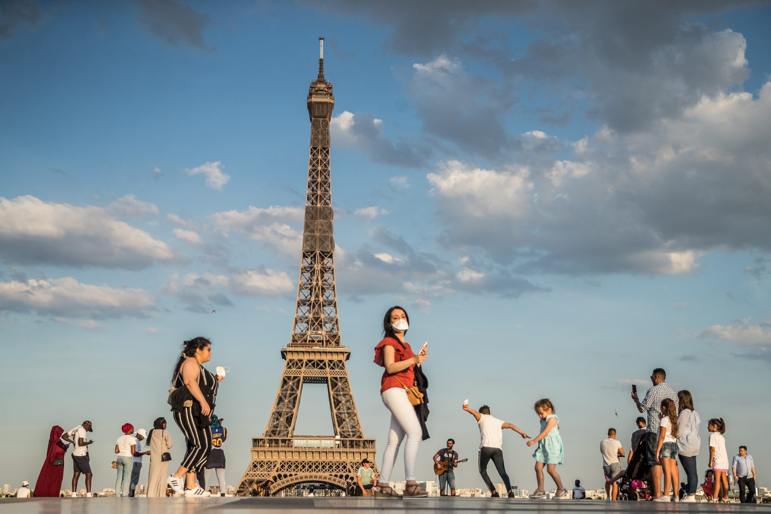 epaselect epa08461746 People dance to music at the Trocadero Human Rights Plaza near the Eiffel Tower in Paris, France, 02 June 2020. France has started a gradual lifting of COVID-19 lockdown restrictions in an effort to restart its economy and help people get back to their daily routines. The country reopened its bars and restaurants after two months of nationwide restrictions due to the coronavirus outbreak.  EPA/MOHAMMED BADRA
