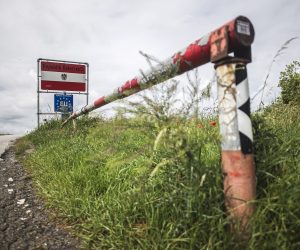 epa08466747 A border sign and border barrier are seen at the Austrian Czech border near Schrattenberg, Austria, 05 June 2020. The Czech Republic opened its borders to Austria on 05 June, amid an easing of lockdown measures with closed boarders and travelling restrictions, which were implemented to stem the spread of the SARS-CoV-2 coronavirus that causes the COVID-19 disease.  EPA/CHRISTIAN BRUNA