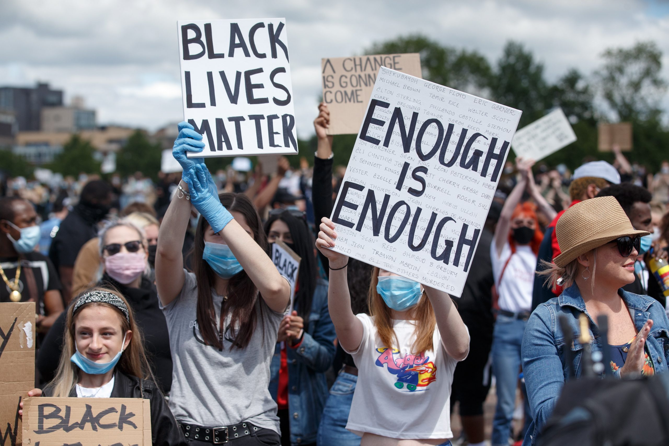 epa08471438 Protesters hold placards during a 'Black Lives Matter' (BLM) demonstration at Glasgow Green, Glasgow, Britain, 07 June 2020. Thousands of people defy the coronavirus lockdown order to take part in the anti-racism demonstration held to condemn the killing of George Floyd, a 46-year-old African-American man who died on 25 May after being detained by police officers in Minneapolis (Minnesota), USA, and to express solidarity with the BLM-led protests currently taking place throughout the US.  EPA/ROBERT PERRY