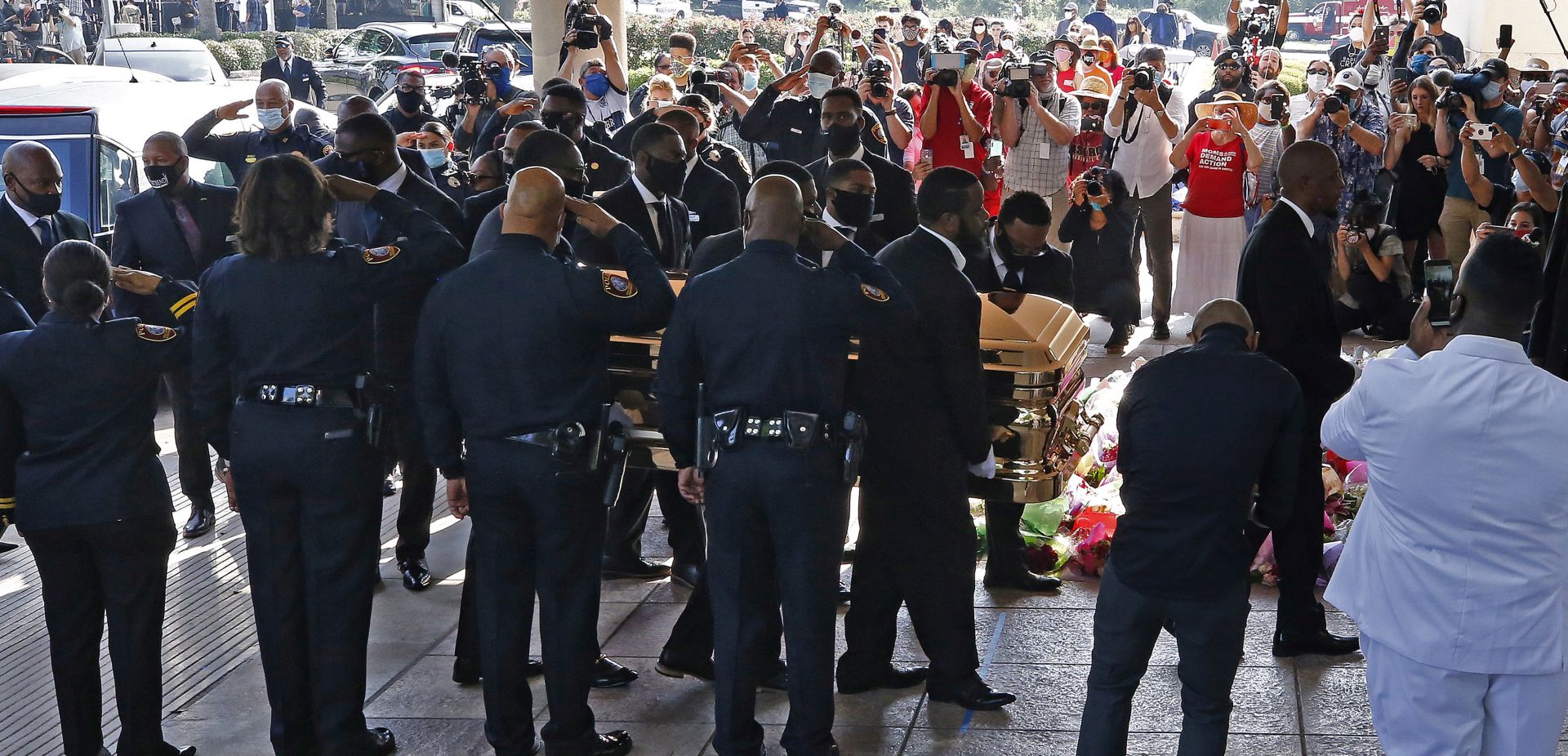 epa08474913 The casket carrying the body of George Floyd is taken into The Fountain of Praise Church before the funeral service for George Floyd in Houston, Texas, USA, 09 June 2020. A bystander's video posted online on 25 May, appeared to show George Floyd, 46, pleading with arresting officers that he couldn't breathe as an officer knelt on his neck. The unarmed Black man later died in police custody and all four officers involved in the arrest have been charged and arrested.  EPA/LARRY W. SMITH