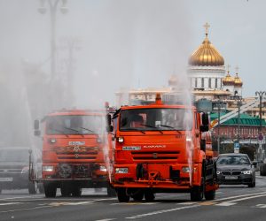 epa08477085 Municipal watering trucks spray disinfectant liquid on an avenue during the lockdown to combat the spread of the SARS-CoV-2 coronavirus which causes the COVID-19 disease in Moscow, Russia, 10 June 2020. Moscow authorities will cancel self-isolation regime from 09 June 2020. All residents of the city, including people over 65 and with chronic illnesses, will be able to go out and travel without restrictions.The requirement to wear masks and gloves in public places will continue.  EPA/YURI KOCHETKOV