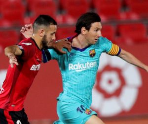 epa08483878 FC Barcelona's Leo Messi (R) in action against RCD Mallorca's Joan Sastre (L) during the Spanish LaLiga soccer match between RCD Mallorca and FC Barcelona at Visit Mallorca Stadium in Palma de Mallorca, Spain, 13 June 2020.  EPA/JUANJO MARTIN