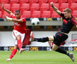 14 June 2020, Rhineland-Palatinate, Mainz: Mainz's Robin Quaison shoots on goal during the German Bundesliga soccer match between FSV Mainz 05 and FC Augsburg at the Opel Arena. Photo: Kai Pfaffenbach/reuters/Pool/dpa - IMPORTANT NOTICE: DFL and DFB regulations prohibit any use of photographs as image sequences and/or quasi-video.