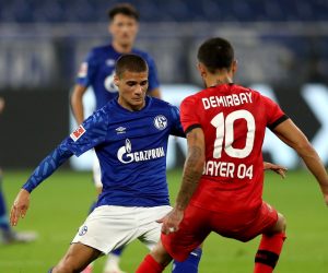 epa08485304 Can Bozdogan (L) of Schalke challenges Kerem Demirbay of Leverkusen during the Bundesliga soccer match between FC Schalke 04 and Bayer 04 Leverkusen at Veltins-Arena in Gelsenkirchen, Germany, 14 June 2020.  EPA/LARS BARON / POOL DFL regulations prohibit any use of photographs as image sequences and/or quasi-video.
