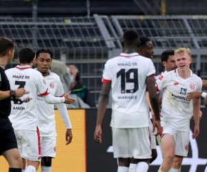 epa08491722 Jonathan Burkardt of Mainz (3-R) jubilates after his 0-1 goal during the Bundesliga match between Borussia Dortmund and 1. FSV Mainz 05 in Dortmund, Germany, 17 June 2020.  EPA/FRIEDEMANN VOGEL / POOL CONDITIONS - ATTENTION: The DFL regulations prohibit any use of photographs as image sequences and/or quasi-video.