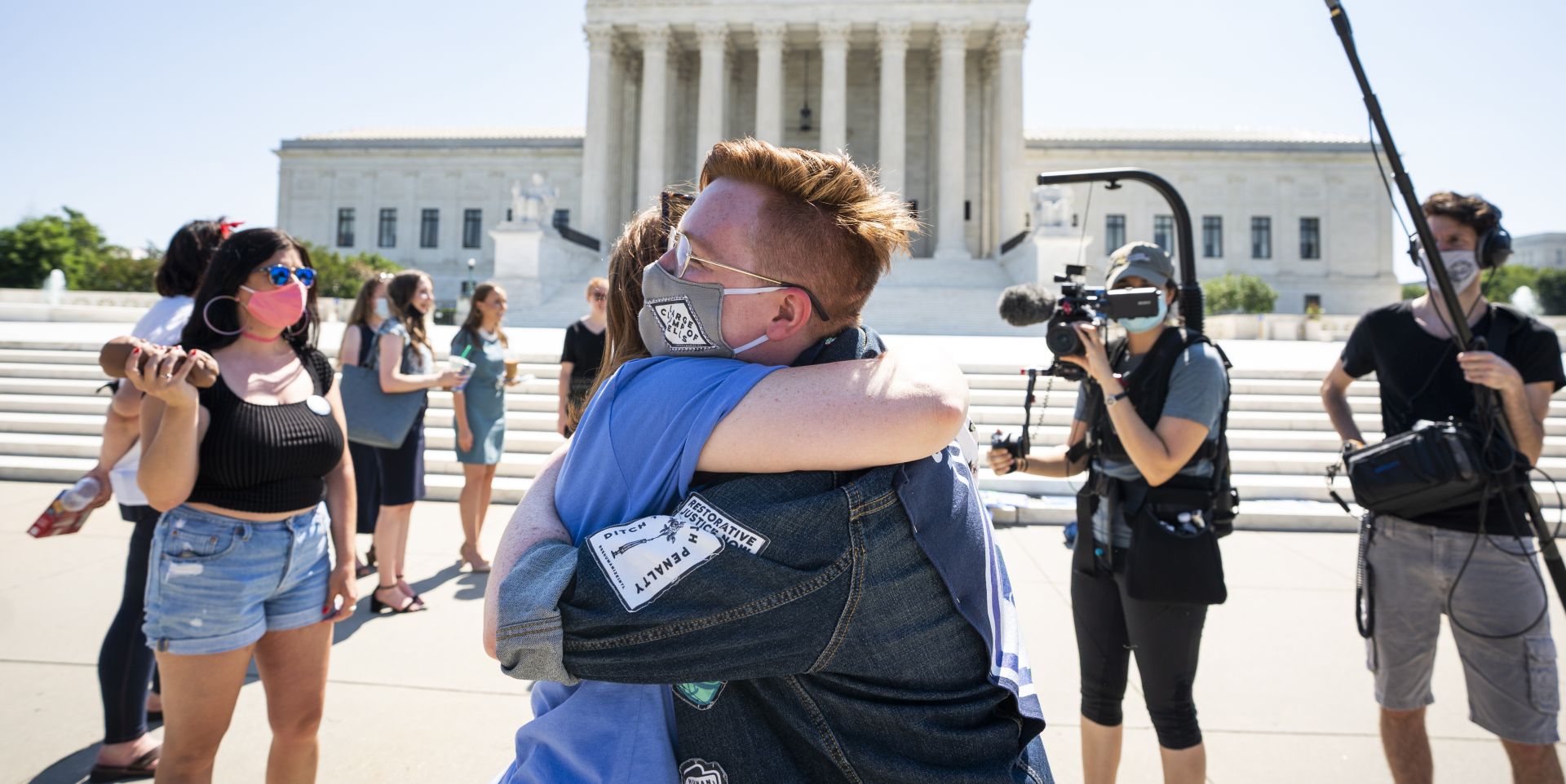 epa08516170 Anti-abortion protesters embrace each other outside the Supreme Court of the United States after it struck down a controversial Louisiana state abortion law in Washington, DC, USA, 29 June 2020. Chief Justice John Roberts voted with the top court's four liberal justices in a 5-4 ruling that declared the law – which was passed in 2014 and required physicians to have active admitting privileges at a hospital near the facility where they provide abortions – unconstitutional. SCOTUS has yet to rule on another high-profile case involving the disclosure of President Donald Trump's financial records and tax returns.  EPA/JIM LO SCALZO