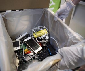 epa08484356 A staff member displays electronic waste at an Advanced Info Service (AIS) shop in Bangkok, Thailand, 05 June 2020 (issued 14 June 2020). Thailand's AIS, a mobile phone operator company, launched its electronic wastes disposal campaign by setting up recycled bins across the country and encouraging people to drop off their electronic waste such as broken mobile phones, earphones, adaptors, old tablets, batteries and other e-waste. Thailand has exceeded 400,000 tons of hazardous waste from electronic appliances.  EPA/RUNGROJ YONGRIT