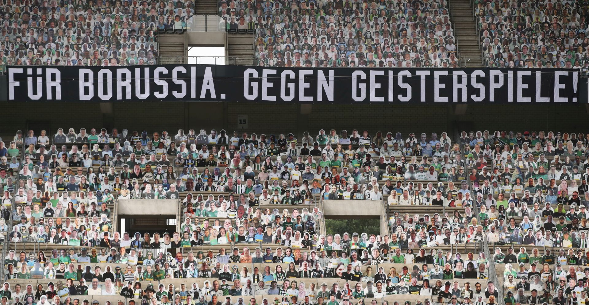 epa08488752 A banner is seen in the stands saying 'Football without fans is nothing' (bottom) prior to the Bundesliga match between Borussia Moenchengladbach and VfL Wolfsburg at Borussia-Park in Moenchengladbach, Germany, 16 June 2020.  EPA/ALEX GRIMM / POOL DFL regulations prohibit any use of photographs as image sequences and/or quasi-video.