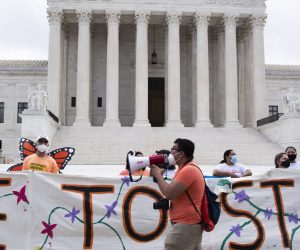 epa08494016 Immigration advocates gather outside the Supreme Court following a ruling in Washington, DC, USA, 18 June 2020. The Supreme Court rejected the Trump administration's move to scrap the program, 'Deferred Action for Childhood Arrivals' (DACA), in a 5-4 ruling written by Chief Justce John Roberts. The decision impacts hundreds of thousands of  immigrants who were brought to the US as children.  EPA/MICHAEL REYNOLDS