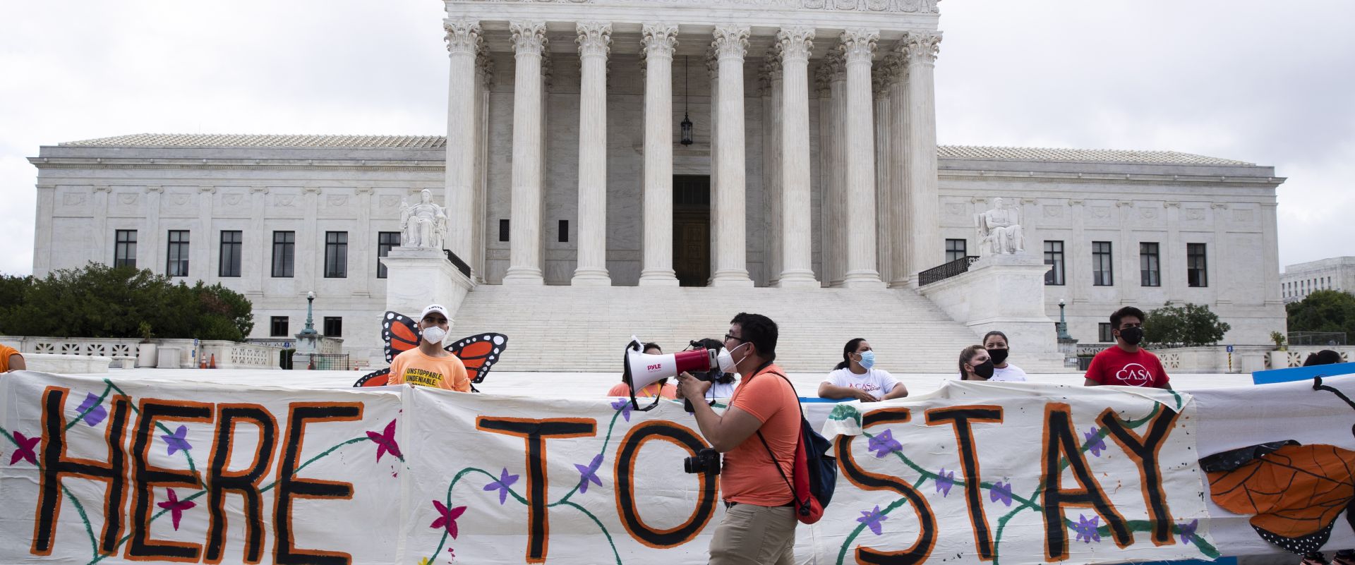 epa08494016 Immigration advocates gather outside the Supreme Court following a ruling in Washington, DC, USA, 18 June 2020. The Supreme Court rejected the Trump administration's move to scrap the program, 'Deferred Action for Childhood Arrivals' (DACA), in a 5-4 ruling written by Chief Justce John Roberts. The decision impacts hundreds of thousands of  immigrants who were brought to the US as children.  EPA/MICHAEL REYNOLDS